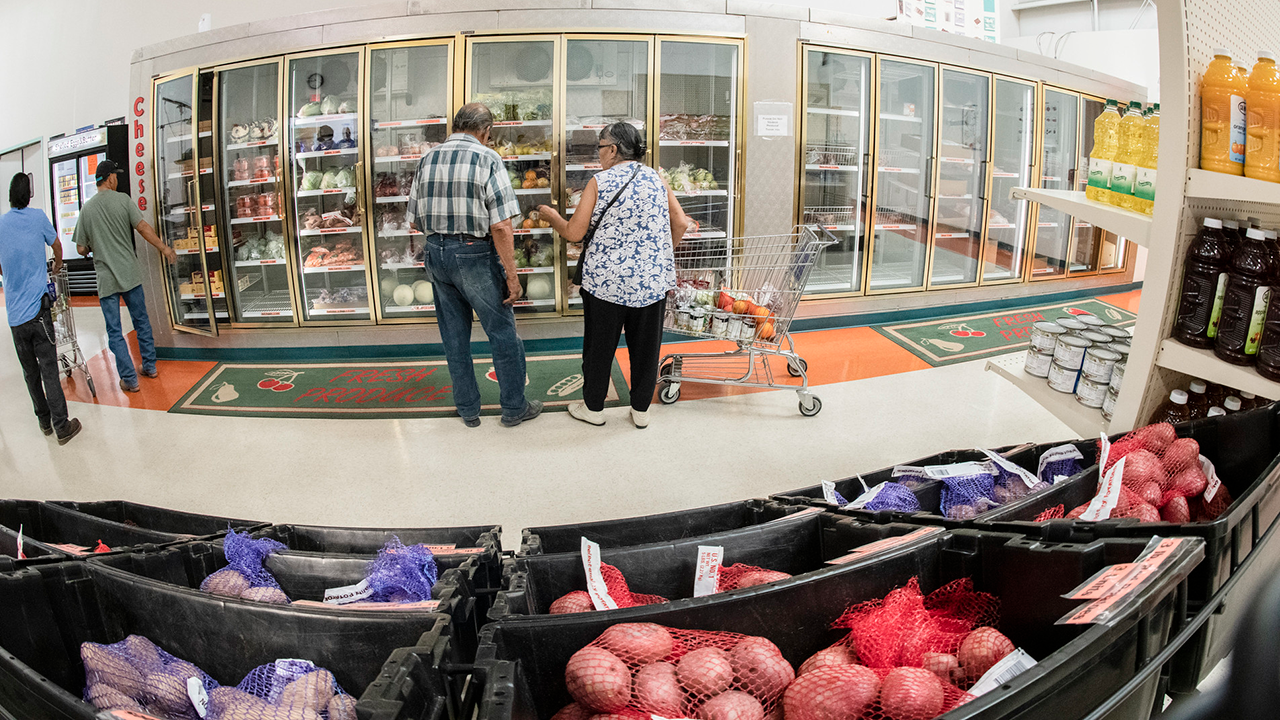People shopping at a grocery store.