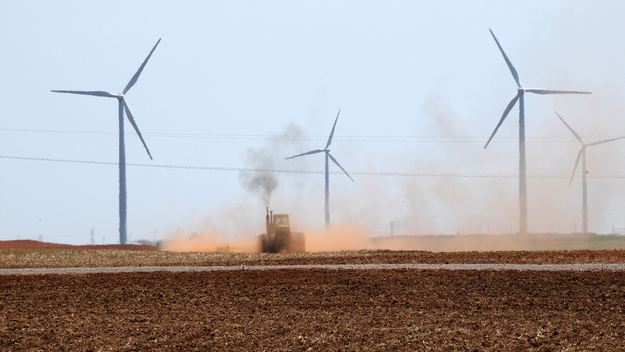 Wind turbines in field.