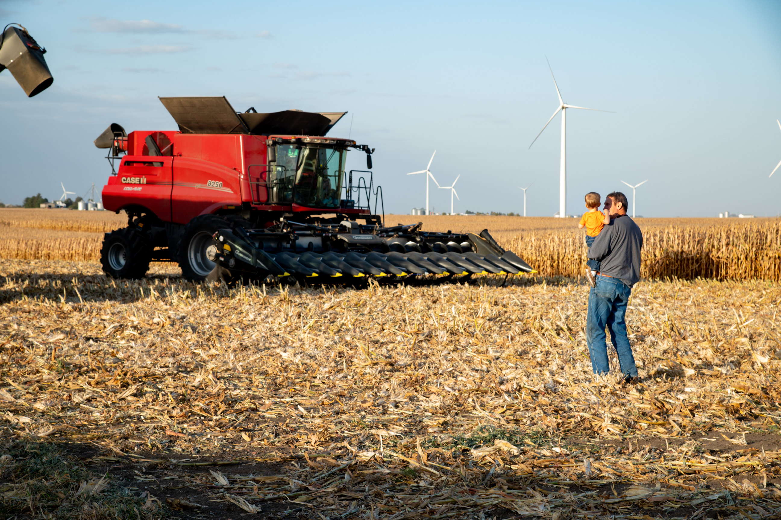 grandfather and child in field