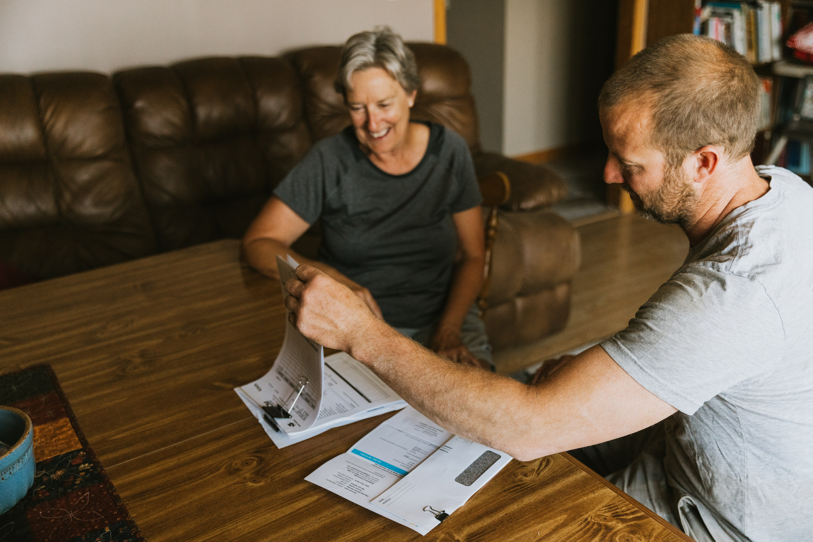 Photo of farm family doing bookwork.