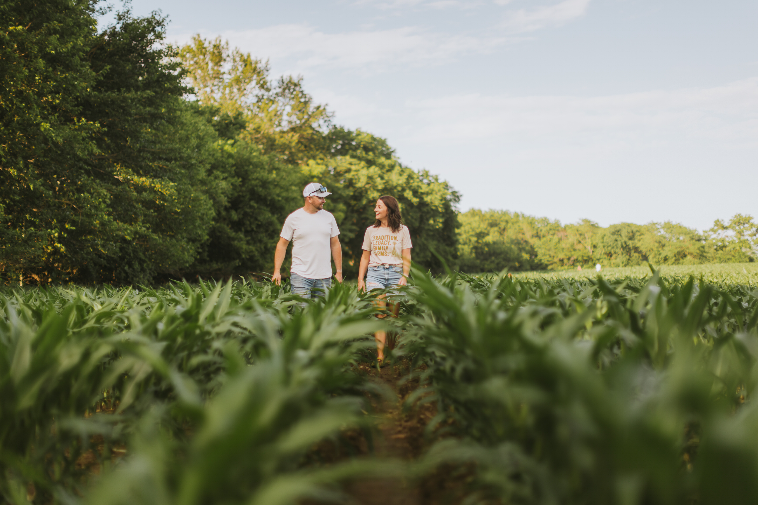 Photo of two farmers in corn field.