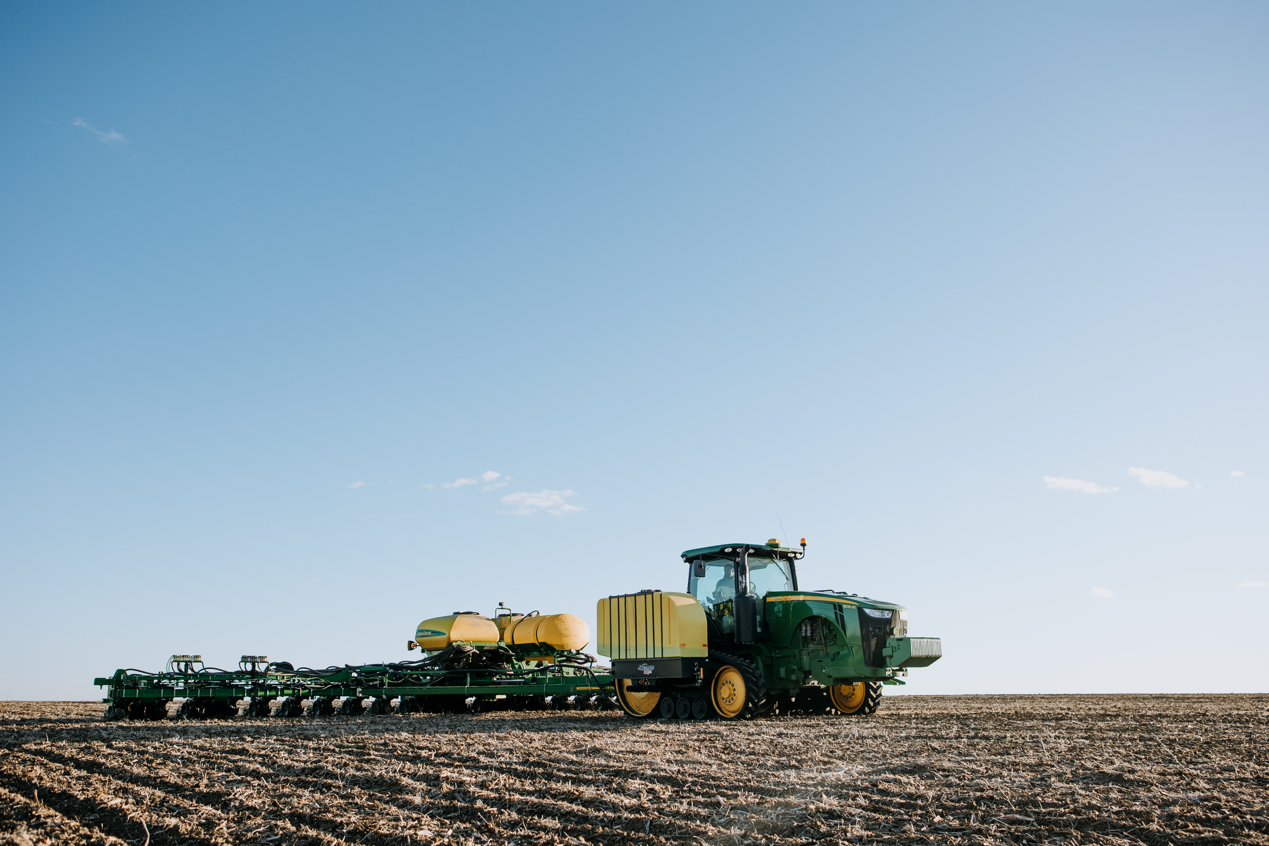 Photo of a tractor planting a field.