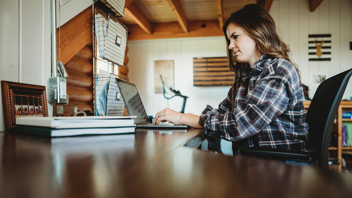 Business owner working at desk.