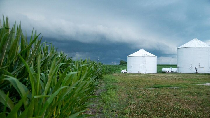 Storm clouds over farm field.