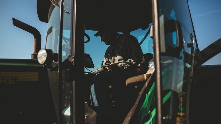 Man in combine cab