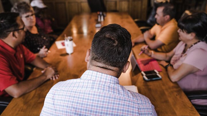 People meeting around table.