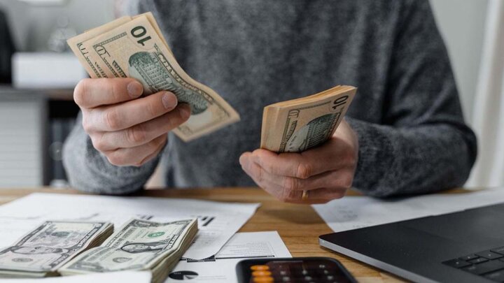 Hands counting cash.