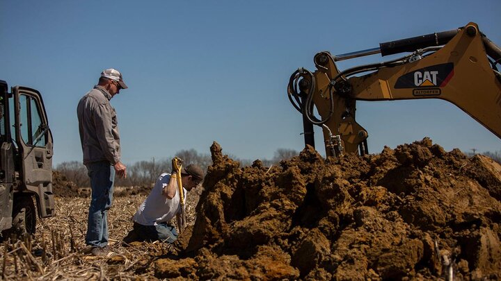 Workers digging a trench