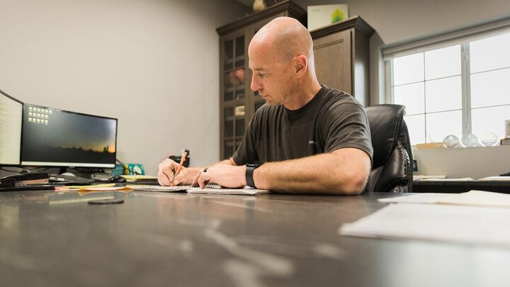 Man working at desk in office.