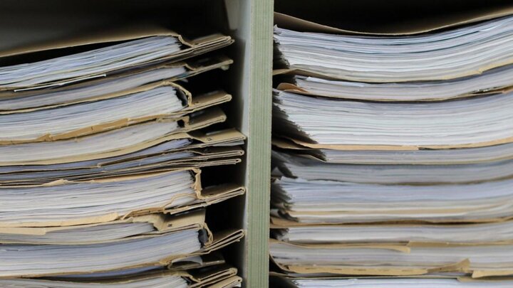 Files on a shelf.