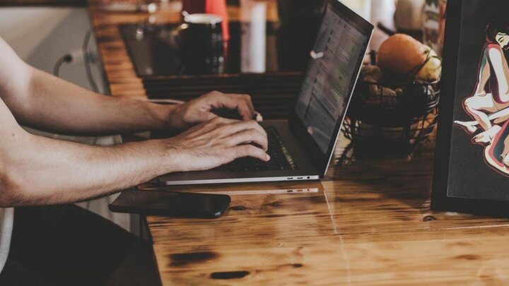 Person working on laptop.