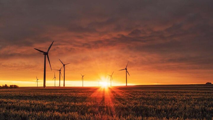 Sunset amid wind turbines.