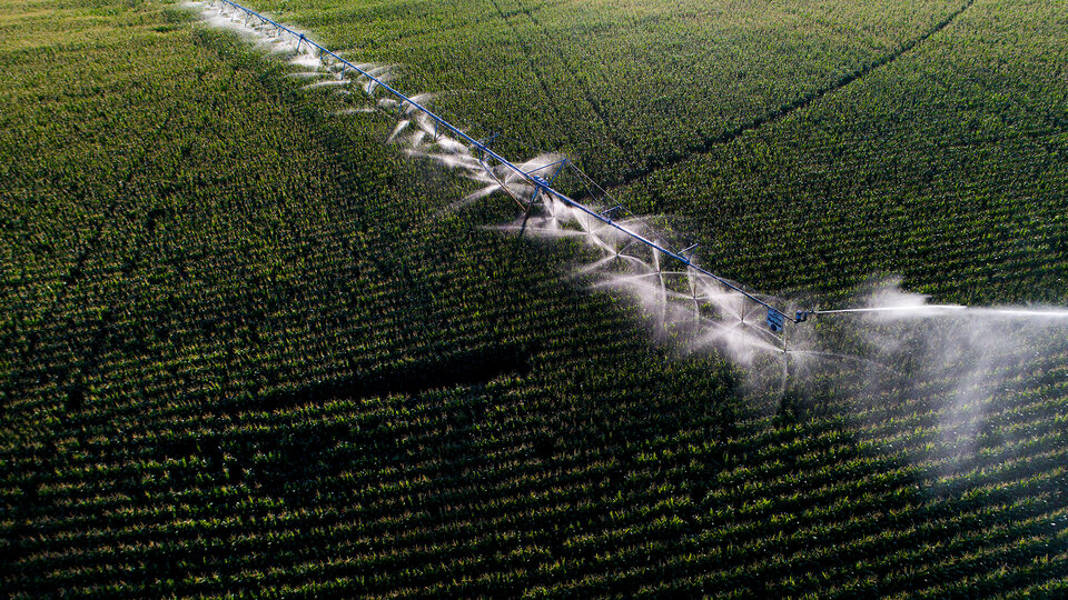 Aerial photo of pivots running in farm field.
