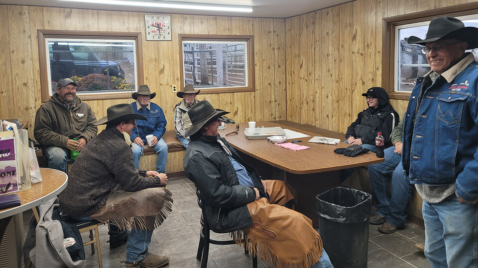 People gathered in a sale barn cafe.