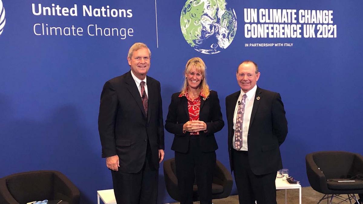 Agriculture Secretary Tom Vilsack with British National Farmers Union President Minette Batters and Global Dairy Platform Exec Director Donald Moore at the COP26 conference .