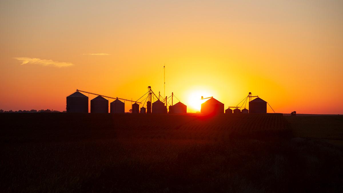 Grain bins at sunset.