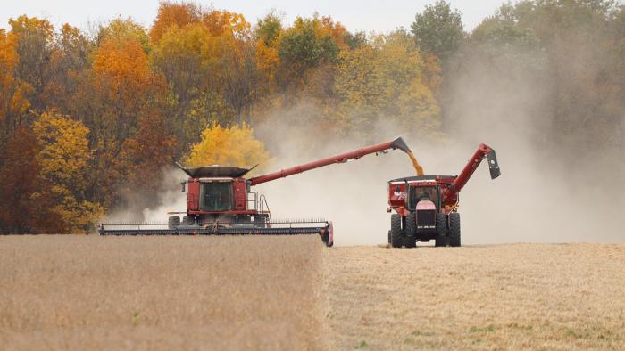 Combine and grain cart harvesting soybeans.