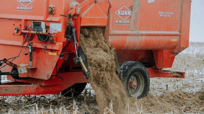 Feed mixer dispensing feed. 