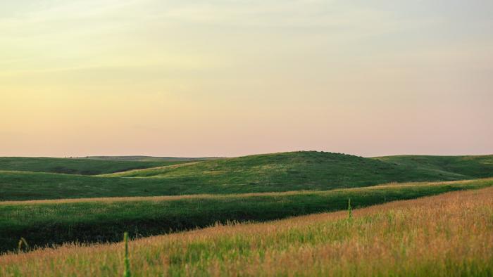 Photo of pastureland and hills.